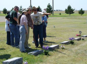 My parents talking to my grandpa at the cemetery in Tyrone, Oklahoma